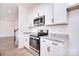 Modern kitchen featuring stainless steel appliances and white cabinets at 107 Megby Trl, Statesville, NC 28677