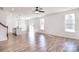 Spacious living room open to a kitchen area, featuring hardwood floors and plenty of natural light at 107 Megby Trl, Statesville, NC 28677