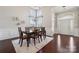 Elegant dining room with hardwood floors, wainscoting, and a stylish chandelier at 1121 Mckee Farm Ln, Belmont, NC 28012