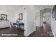 Long hallway with wood flooring and a view of the office and living room at 121 Meadow View Dr, Statesville, NC 28677
