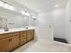 Luxurious bathroom with dual vanity, a glass-enclosed shower, and modern fixtures plus tile floors at 13126 Macon Hall Dr, Mint Hill, NC 28227