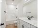 This bathroom features modern fixtures, a tub-shower combo, and a white vanity at 13126 Macon Hall Dr, Mint Hill, NC 28227