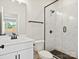 Modern bathroom featuring a marble shower, vanity, and black fixtures at 13126 Macon Hall Dr, Mint Hill, NC 28227