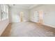 Neutral bedroom with carpet floors, light-colored walls, base molding and two entry doors at 13126 Macon Hall Dr, Mint Hill, NC 28227