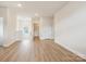 Bright bonus room showcasing wood-look floors, recessed lighting, and open space perfect for various activities at 13126 Macon Hall Dr, Mint Hill, NC 28227