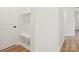 Clean entryway featuring built-in bench seating, storage, and hardwood floors leading to the interior at 13126 Macon Hall Dr, Mint Hill, NC 28227