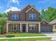Beautiful brick home featuring a manicured lawn and a two-car garage at 13126 Macon Hall Dr, Mint Hill, NC 28227