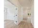 Hallway featuring hardwood floors, paneled walls, and neutral paint at 13126 Macon Hall Dr, Mint Hill, NC 28227