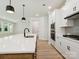 Modern kitchen featuring a large island with quartz countertop and stainless steel appliances at 13126 Macon Hall Dr, Mint Hill, NC 28227