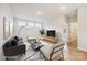 Stylish living room with comfortable seating, large windows, and chic decor, ideal for relaxing or entertaining at 13126 Macon Hall Dr, Mint Hill, NC 28227
