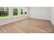 Spacious living room featuring large windows and hardwood floors at 13126 Macon Hall Dr, Mint Hill, NC 28227