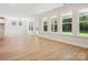 Sun-filled open layout with expansive windows showcasing backyard view, perfect for entertaining at 13126 Macon Hall Dr, Mint Hill, NC 28227
