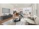 Open-concept living room and kitchen with modern decor and stainless steel appliances, perfect for entertaining at 13126 Macon Hall Dr, Mint Hill, NC 28227