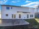 Spacious backyard with a concrete patio and bright white siding at 13903 Mallard Roost Rd, Charlotte, NC 28262