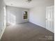 Inviting bedroom with large windows and plush carpeting at 13903 Mallard Roost Rd, Charlotte, NC 28262