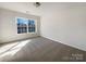 Cozy bedroom with carpet floors, natural light, and neutral paint at 13903 Mallard Roost Rd, Charlotte, NC 28262