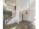 Open dining room space with wood floors, chandelier, and wainscoting details at 13903 Mallard Roost Rd, Charlotte, NC 28262