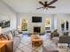 Bright living room featuring a fireplace, neutral decor, plush carpet, and large windows at 13903 Mallard Roost Rd, Charlotte, NC 28262