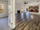 Spacious living room with fireplace, wood floors, and lots of natural light at 13903 Mallard Roost Rd, Charlotte, NC 28262