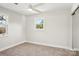 Bedroom filled with natural light featuring carpet floors and two large windows at 14325 Rocky River E Rd, Davidson, NC 28036