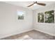 Bright bedroom with neutral walls, carpeted floor and ceiling fan at 14325 Rocky River E Rd, Davidson, NC 28036