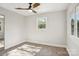 Bright bedroom with neutral walls, carpeted floor and ceiling fan at 14325 Rocky River E Rd, Davidson, NC 28036
