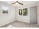 Bright bedroom with neutral walls, carpeted floor and ceiling fan at 14325 Rocky River E Rd, Davidson, NC 28036