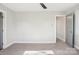 Empty bedroom featuring neutral colored walls and carpet, and a ceiling fan at 14325 Rocky River E Rd, Davidson, NC 28036