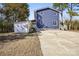 Two-story home with blue siding and a long concrete driveway at 14325 Rocky River E Rd, Davidson, NC 28036