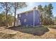 Back view of this exterior elevation featuring siding, windows, and a back yard at 14325 Rocky River E Rd, Davidson, NC 28036