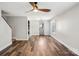 Bright living room with hardwood floors, ceiling fan, and a neutral color scheme at 14325 Rocky River E Rd, Davidson, NC 28036