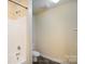 The bathroom has a tub with shower combination, white toilet and neutral walls at 1541 Arborgate Dr, Rock Hill, SC 29732