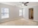 Neutral bedroom featuring two large windows and overhead fan that offer comfortable lighting and ventilation at 1541 Arborgate Dr, Rock Hill, SC 29732