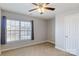 Inviting bedroom features soft carpet and a view of the neighborhood for a serene living space at 1541 Arborgate Dr, Rock Hill, SC 29732