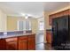The kitchen features wooden cabinets, sleek countertops, and a modern black refrigerator for a contemporary feel at 1541 Arborgate Dr, Rock Hill, SC 29732