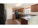 Well-equipped kitchen with dark cabinets, stainless steel appliances, and ample counter space at 1541 Arborgate Dr, Rock Hill, SC 29732