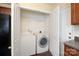 Efficient laundry room with washer and dryer in closet with shelving and door for convenient storage at 1541 Arborgate Dr, Rock Hill, SC 29732