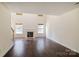 Bright and airy living room featuring hardwood floors, a fireplace, and large windows at 1541 Arborgate Dr, Rock Hill, SC 29732