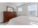 Bright bedroom featuring natural light from windows, a mirror dresser, and a bed at 1645 Unison Dr, Charlotte, NC 28262
