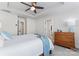 Relaxing bedroom with a ceiling fan, an oak dresser, and bright windows at 1645 Unison Dr, Charlotte, NC 28262