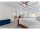 Comfortable bedroom with a ceiling fan, large windows, and neutral-toned carpet at 1645 Unison Dr, Charlotte, NC 28262
