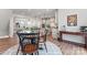 Open floor plan view from dining area into kitchen and living room with lots of natural light at 1645 Unison Dr, Charlotte, NC 28262