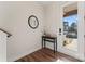 Bright entryway with a modern table, mirror, and a clear view of the front door and exterior at 1645 Unison Dr, Charlotte, NC 28262