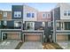 Exterior garage and back balconies show architectural details of the townhome community at 1645 Unison Dr, Charlotte, NC 28262
