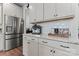 Well-organized kitchen with stainless steel refrigerator, granite countertops, and modern appliances at 1645 Unison Dr, Charlotte, NC 28262