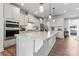 Modern kitchen boasts a large island with granite countertops and stainless steel appliances at 1645 Unison Dr, Charlotte, NC 28262