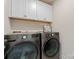 Laundry room featuring LG washer and dryer and extra cabinets for storage at 1645 Unison Dr, Charlotte, NC 28262