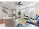 Inviting living room with stylish furniture, large windows, and view of the modern staircase at 1645 Unison Dr, Charlotte, NC 28262