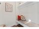 Mudroom with a built-in bench, decorative pillows, and a shelf, combining functionality with modern decor at 1645 Unison Dr, Charlotte, NC 28262