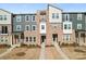Beautiful townhome exterior showcases a mix of stone and siding, creating a welcoming facade at 1645 Unison Dr, Charlotte, NC 28262